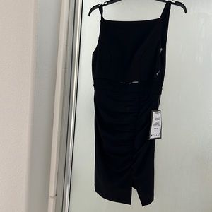 Bought for graduation photos and wore a different dress. This is new with tags